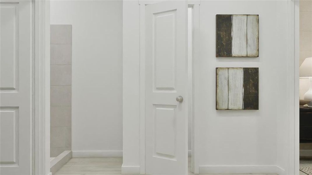 Full bath featuring baseboards and a stall shower Full bath featuring baseboards and a stall shower