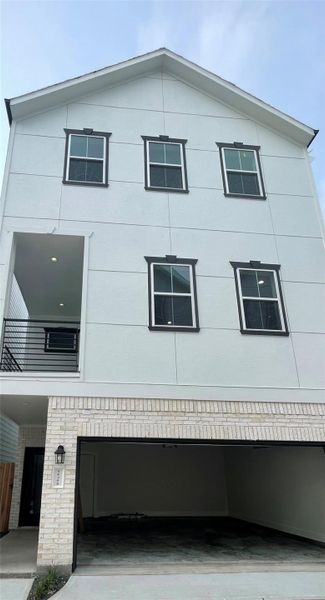 Front exterior of a new home in , Houston, TX, highlighting curb appeal (Image 24).