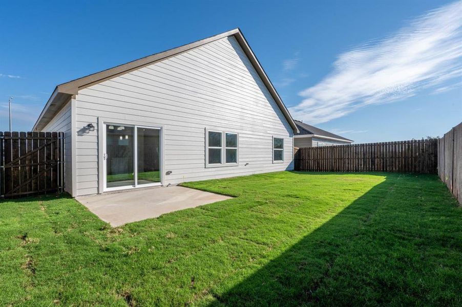Exterior details and patio area of a home in Trails of Fossil Creek, Fort Worth (Image 4).