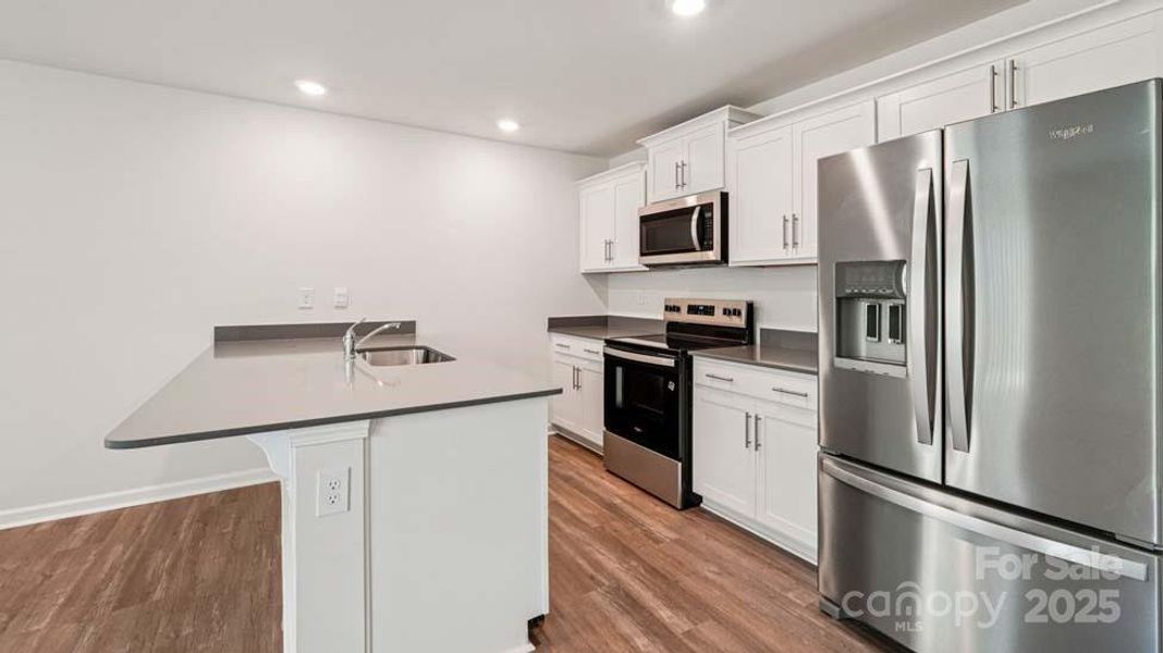 Furnished interior view inside a new home in Mallard Creek Townhomes, Charlotte (Image 6). Furnished interior view inside a new home in Mallard Creek Townhomes, Charlotte (Image 6).