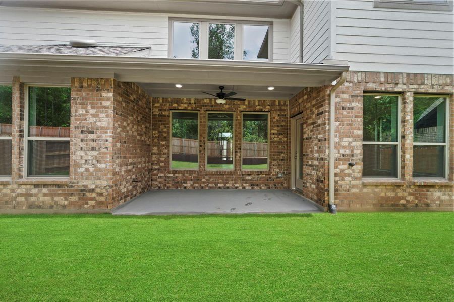 Exterior details and patio area of a home in Wildtree, Magnolia (Image 4). Exterior details and patio area of a home in Wildtree, Magnolia (Image 4).