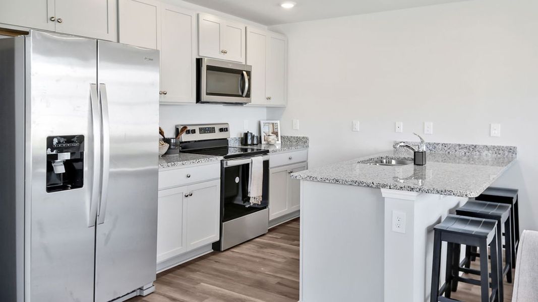 Representative furnished interior of a home built from the MITCHELL TOWNHOME by D.R. Horton in Grayson Park Townhomes, Leland (Image 11). Representative furnished interior of a home built from the MITCHELL TOWNHOME by D.R. Horton in Grayson Park Townhomes, Leland (Image 11).