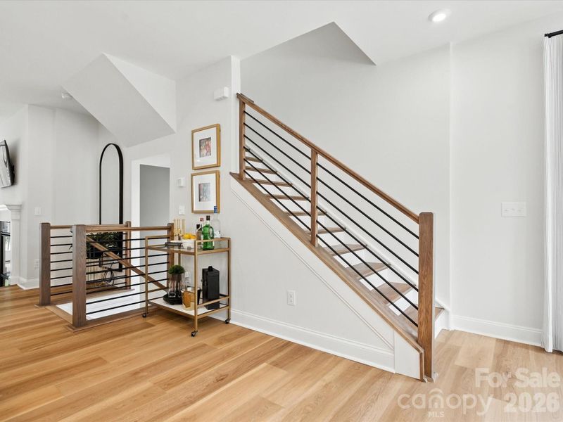 Second floor landing with oak box stairs and black metal balusters Second floor landing with oak box stairs and black metal balusters