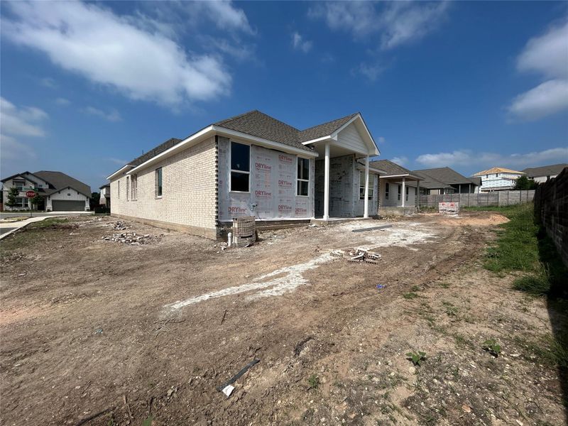 Front exterior of a new home in Provence 50s, Austin, TX, highlighting curb appeal (Image 13). Front exterior of a new home in Provence 50s, Austin, TX, highlighting curb appeal (Image 13).