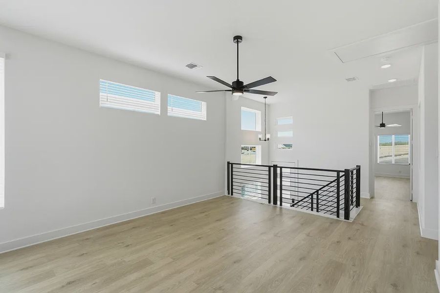 Representative unfurnished interior of a home built from the Athena by Chesmar Homes in Prominence Urban, San Antonio (Image 19).