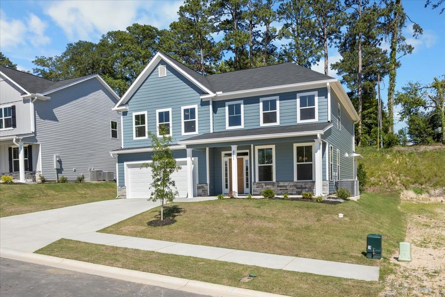 Front exterior of a new home in Forrest Bluff, North Augusta, SC, highlighting curb appeal (Image 23). Front exterior of a new home in Forrest Bluff, North Augusta, SC, highlighting curb appeal (Image 23).