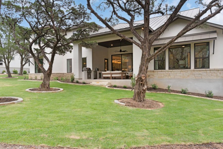 Exterior details and patio area of a home in Enchanted Bluff, Garden Ridge (Image 31).