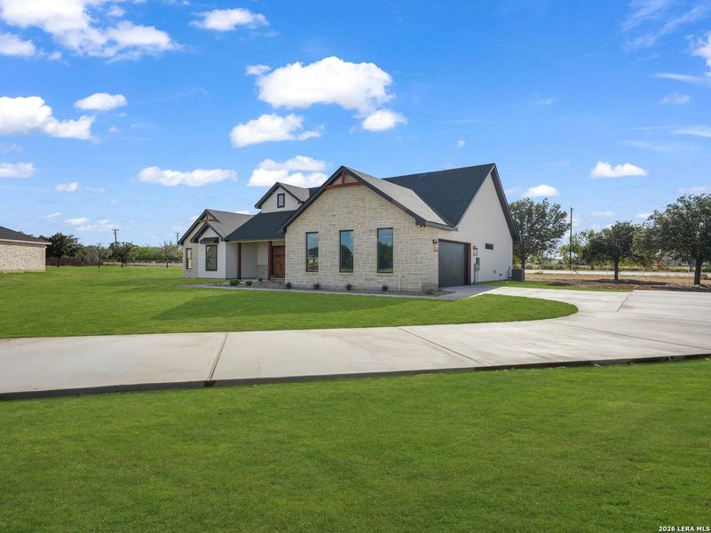 Front exterior of a new home in , Lytle, TX, highlighting curb appeal (Image 2). Front exterior of a new home in , Lytle, TX, highlighting curb appeal (Image 2).