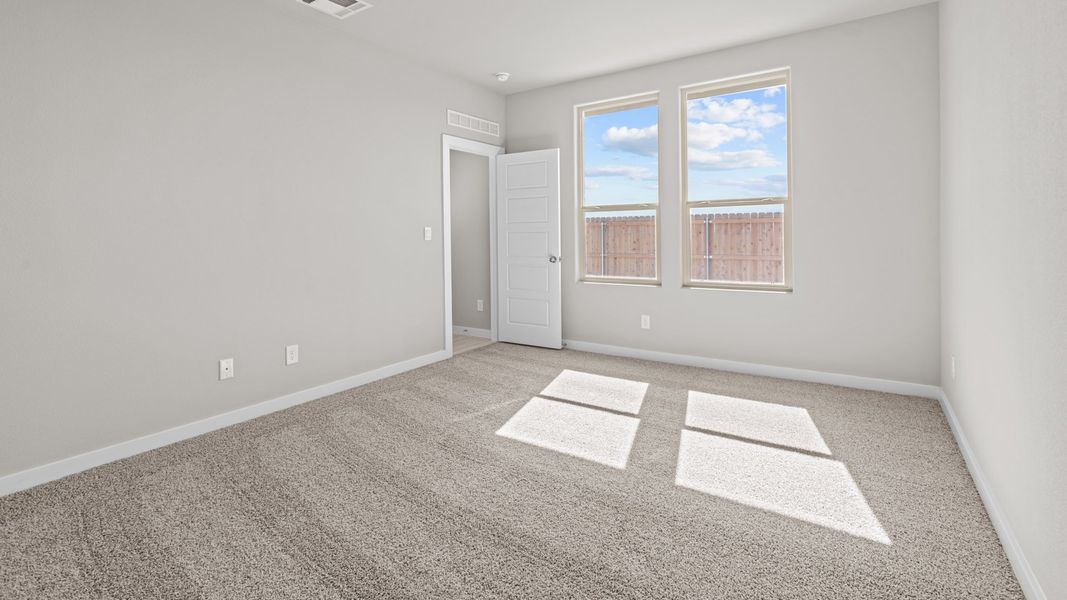 Representative unfurnished interior of a home built from the Jaxson by D.R. Horton in Legacy South, Midland (Image 16).