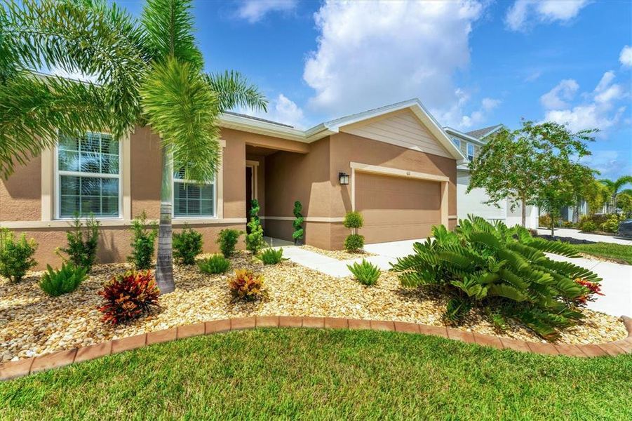 Front exterior of a new home in , Parrish, FL, highlighting curb appeal (Image 20).
