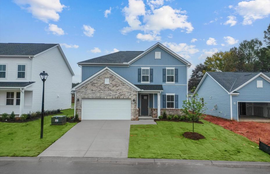 Front exterior of a new home in Fox Hollow, Spartanburg, SC, highlighting curb appeal (Image 21).