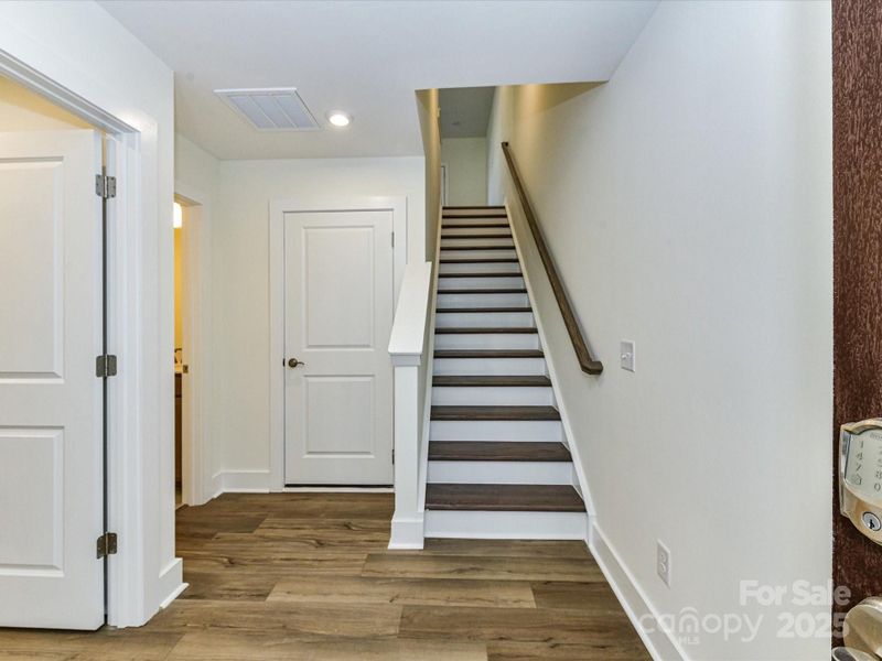 Entry to First Floor with Oak Box Stairs Leading to Second Floor.