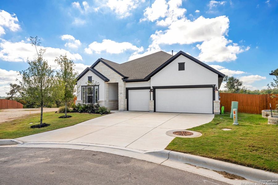 Front exterior of a new home in Meyer Ranch – Legacy Series, New Braunfels, TX, highlighting curb appeal (Image 22).