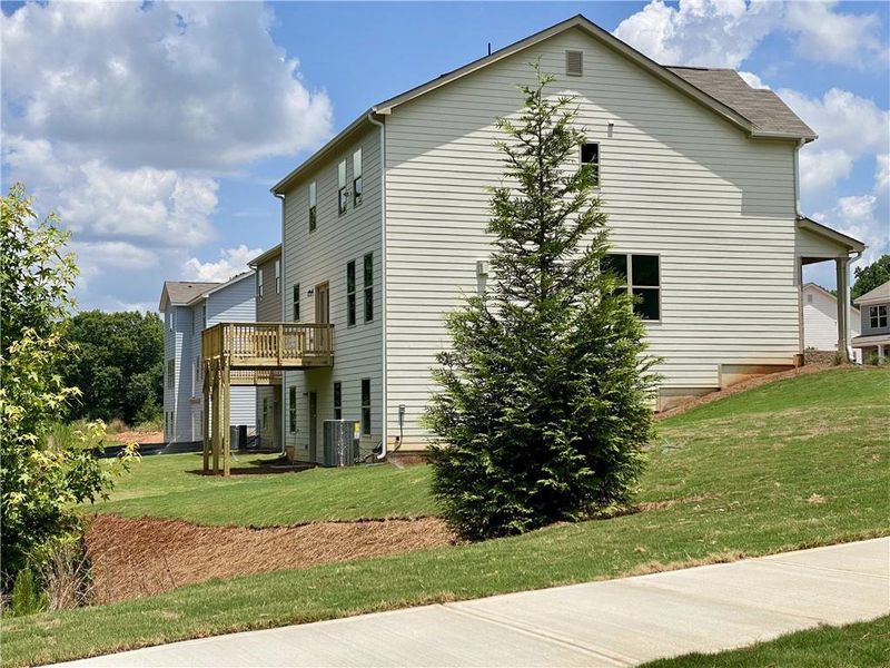 Front exterior of a new home in Hellen Valley, Braselton, GA, highlighting curb appeal (Image 21).