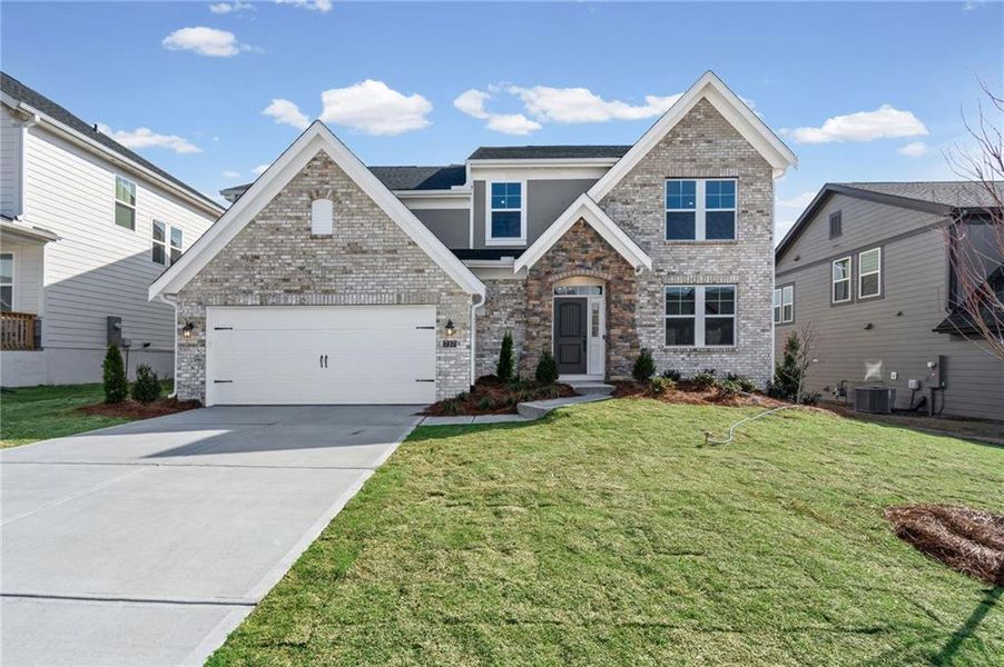 Front exterior of a new home in Twin Lakes, Hoschton, GA, highlighting curb appeal (Image 25). Front exterior of a new home in Twin Lakes, Hoschton, GA, highlighting curb appeal (Image 25).