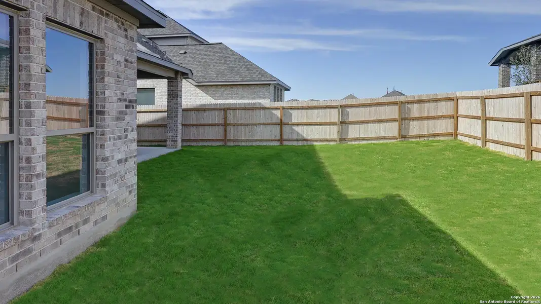 Exterior details and patio area of a home in Ladera 50', San Antonio (Image 4).