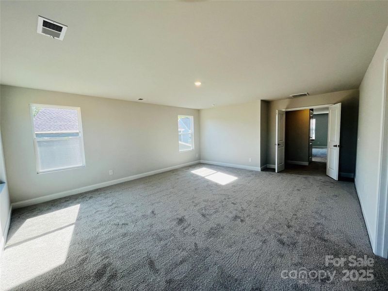 Double door entry into your huge primary bedroom!