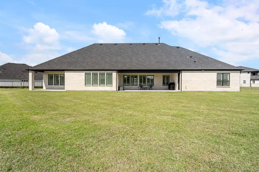 The expansive backyard offers the perfect blank canvas to design your ultimate outdoor playground or private retreat.