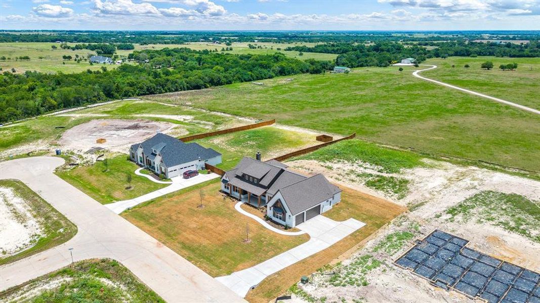 Birds eye view of property featuring a rural view