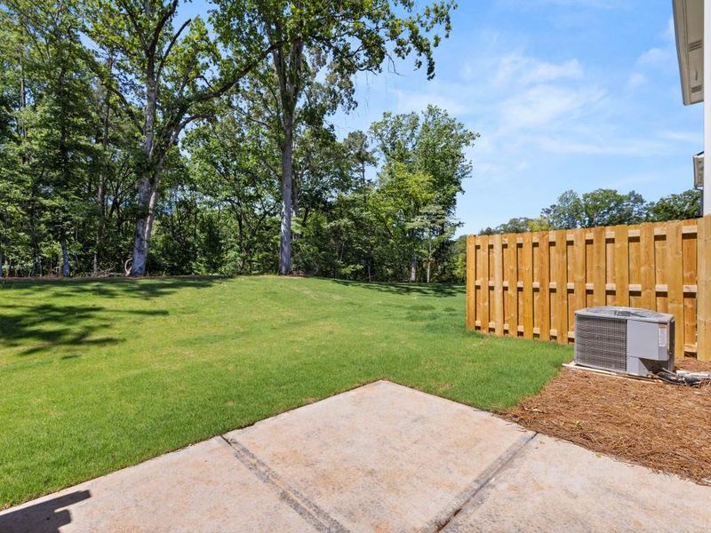 Exterior details and patio area of a home in Falcon Landing Townhomes, Gainesville (Image 20).