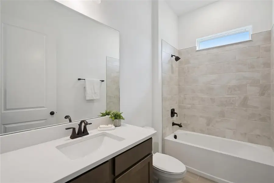 Furnished interior view inside a new home in Laureate Park, Orlando (Image 6).