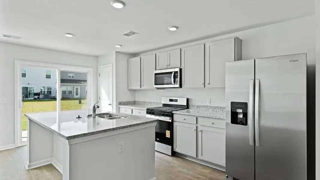 Furnished interior view inside a new home in Pine Hills Townhomes at Cane Bay, Summerville (Image 6). Furnished interior view inside a new home in Pine Hills Townhomes at Cane Bay, Summerville (Image 6).