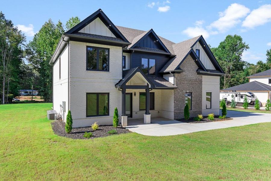 Front exterior of a new home in , Jefferson, GA, highlighting curb appeal (Image 26).