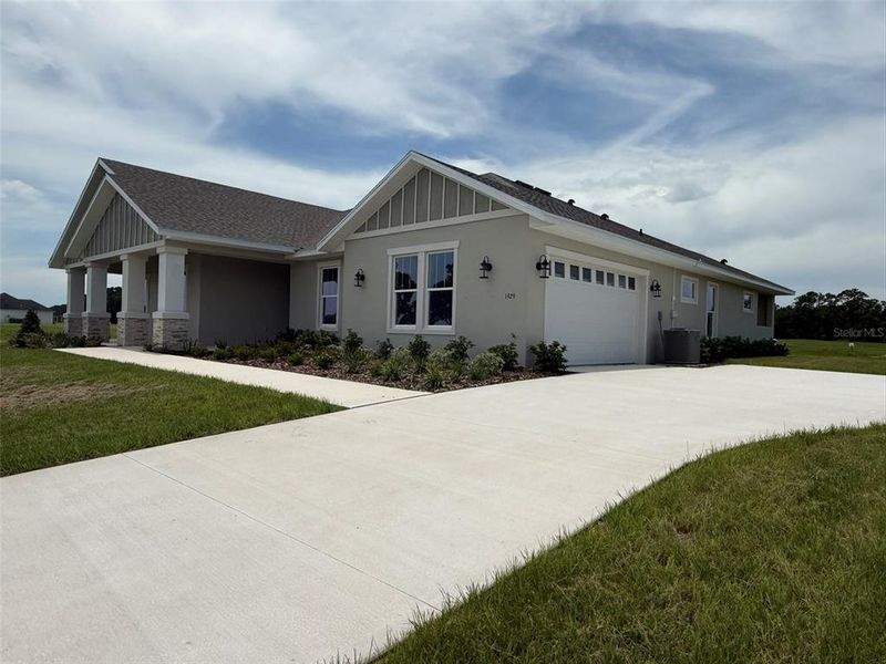 Front exterior of a new home in , Ocala, FL, highlighting curb appeal (Image 8).