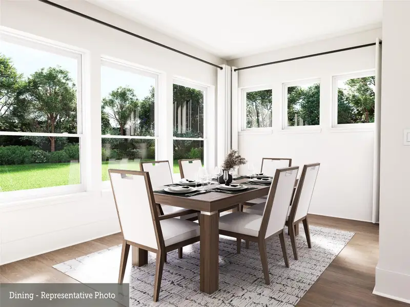 REPRESENTATIVE PHOTO:  Large Dining aera is surrounded by windows, bringing the outside in!