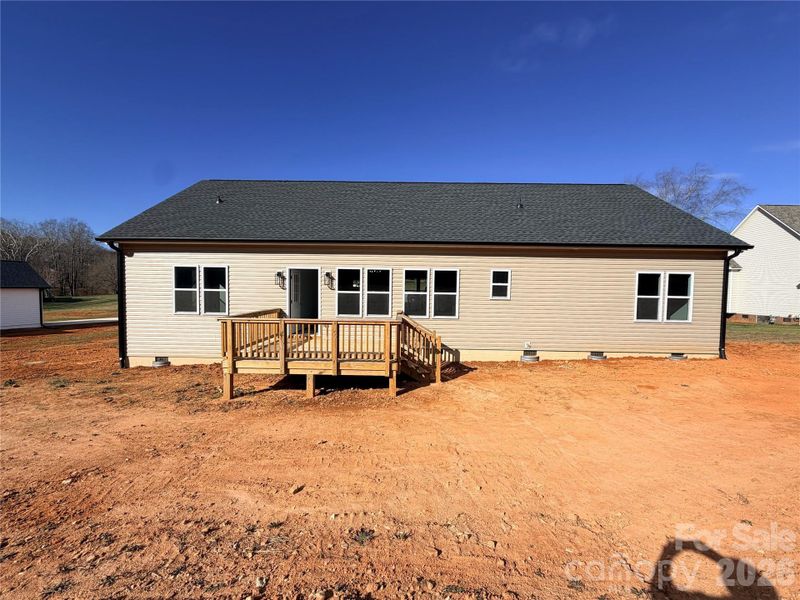 Back of home with deck