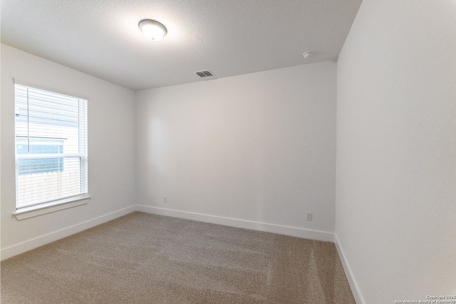 Spacious, unfurnished interior of a new home in The Woodlands at Medina Hills, Mico (Image 12).