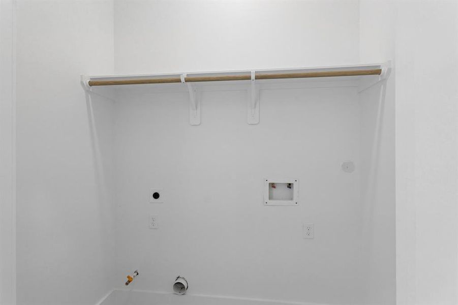 This laundry room is located on the third floor, it has dryer and washer connections.