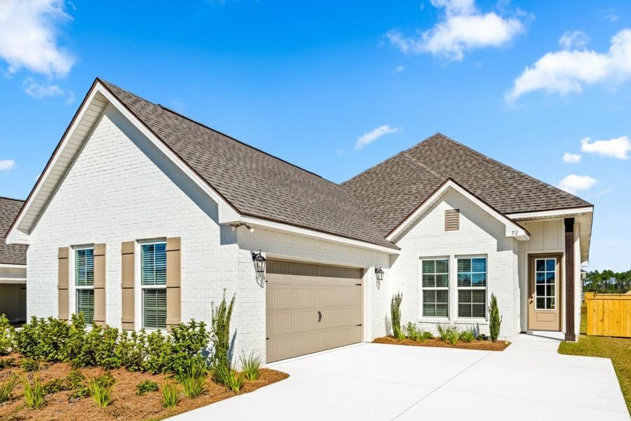 Front exterior of a new home in Natureview, Freeport, FL, highlighting curb appeal (Image 1).