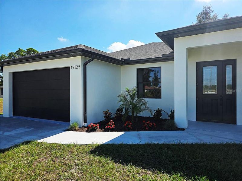 Exterior details and patio area of a home in , North Port (Image 28).