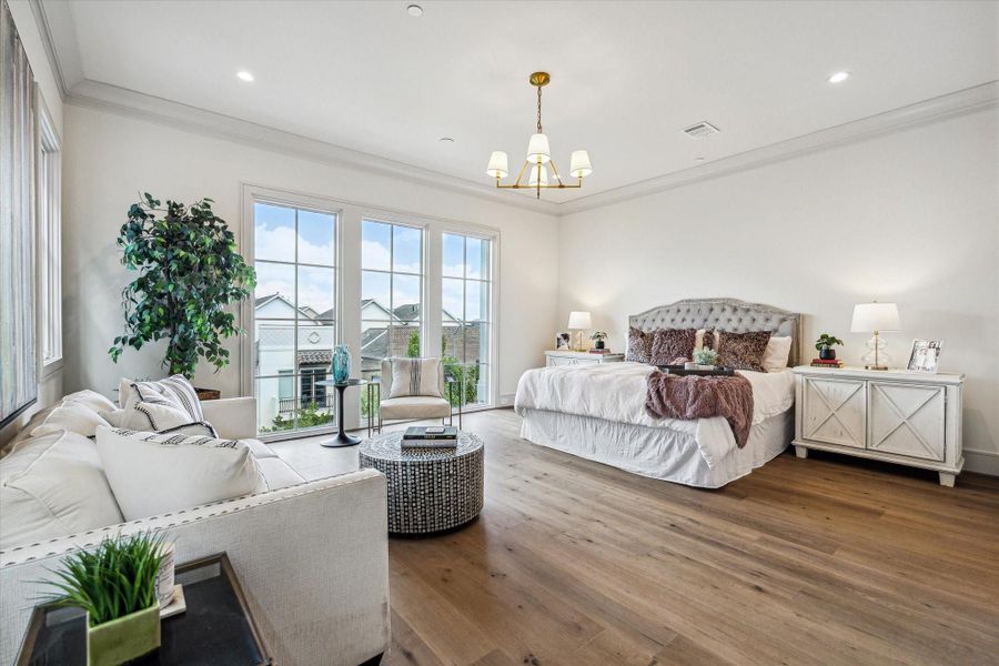The primary bedroom showcases the wide-plank engineered European French Oak Old Vineyard flooring. Perth chandelier, crown moulding, and large windows make this a welcome oasis. The primary bedroom showcases the wide-plank engineered European French Oak Old Vineyard flooring. Perth chandelier, crown moulding, and large windows make this a welcome oasis.