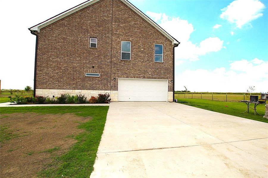 Front exterior of a new home in , Corsicana, TX, highlighting curb appeal (Image 25). Front exterior of a new home in , Corsicana, TX, highlighting curb appeal (Image 25).