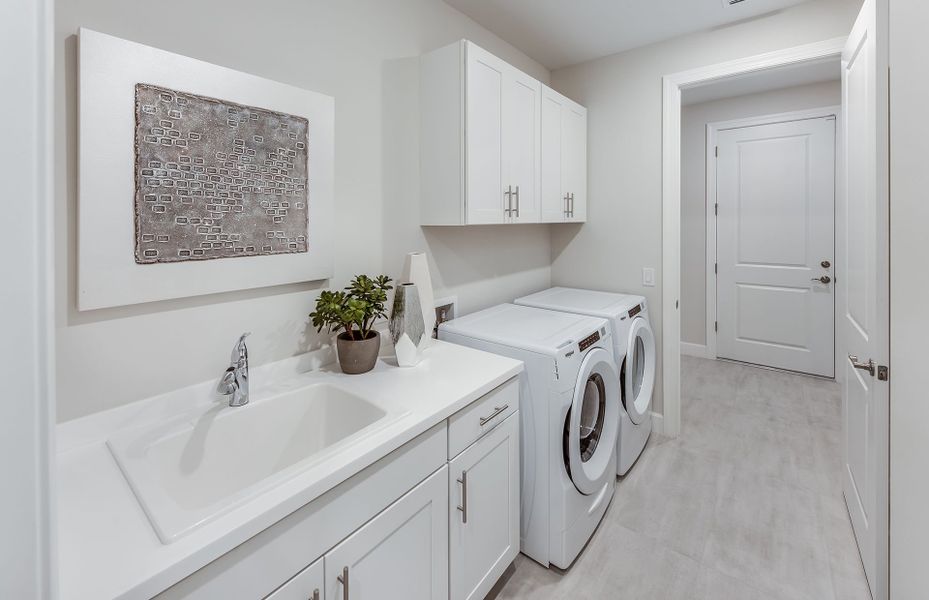 Large laundry room with a flow through layout