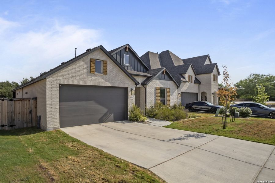 Front exterior of a new home in VIDA, San Antonio, TX, highlighting curb appeal (Image 21).