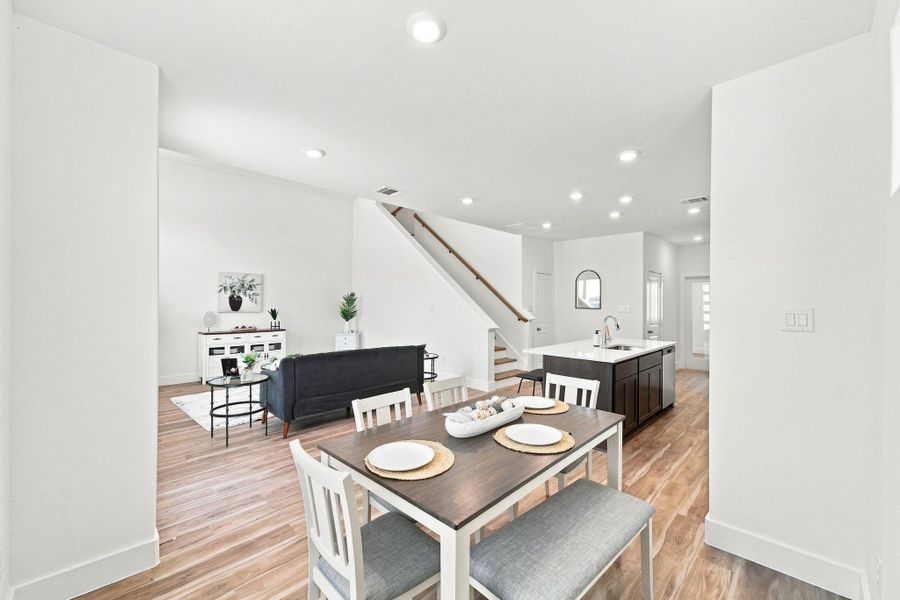 Bright breakfast area with abundant natural light and an open layout that flows seamlessly into the kitchen and living space. Bright breakfast area with abundant natural light and an open layout that flows seamlessly into the kitchen and living space.