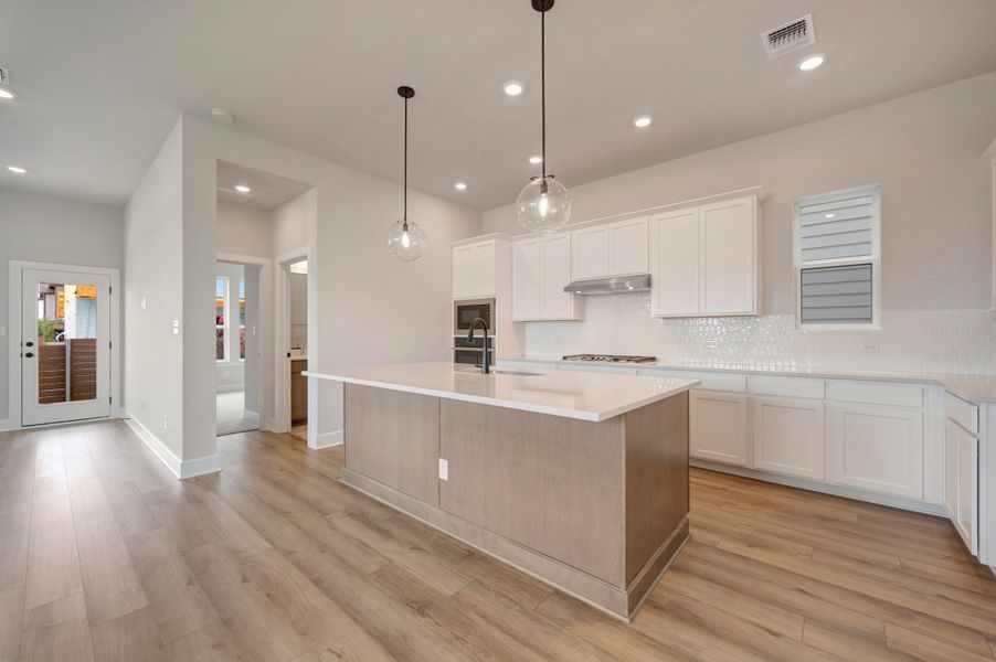 Furnished interior view inside a new home in Double Creek Crossing, Round Rock (Image 6).