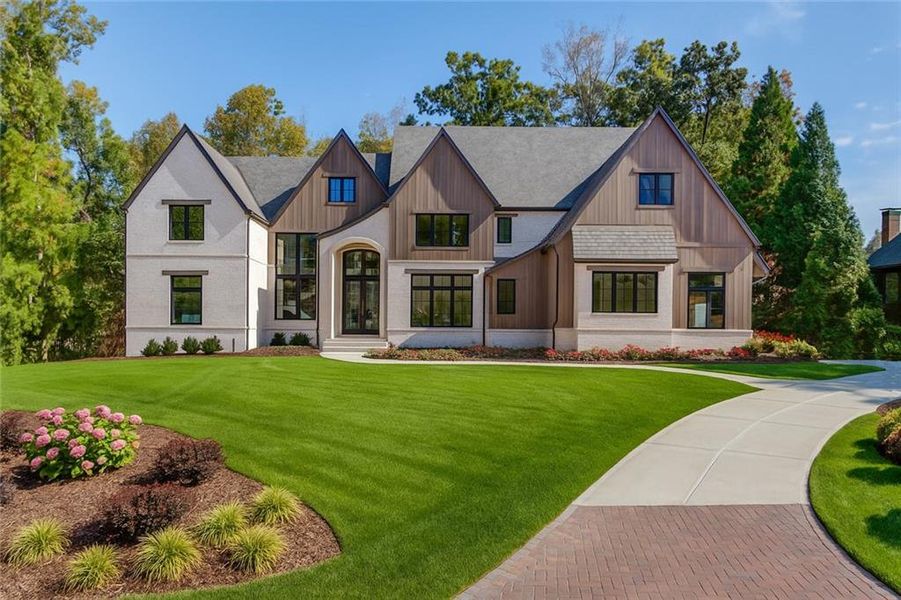 Front exterior of a new home in , Suwanee, GA, highlighting curb appeal (Image 10).
