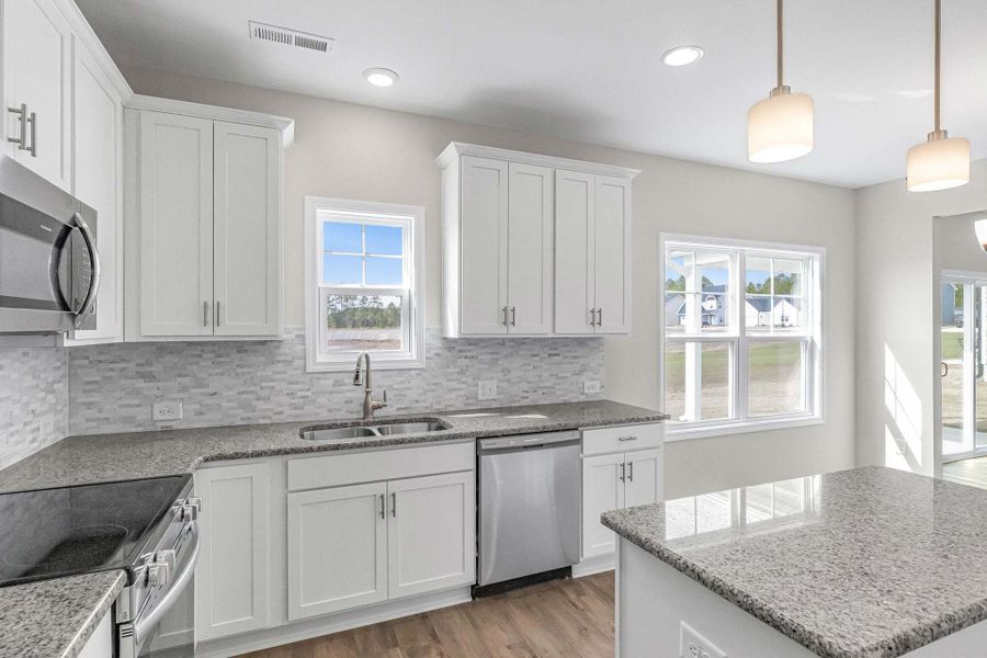 Representative furnished interior of a home built from the Magnolia by Caviness & Cates Communities in Bartlett Manor, Youngsville (Image 202).
