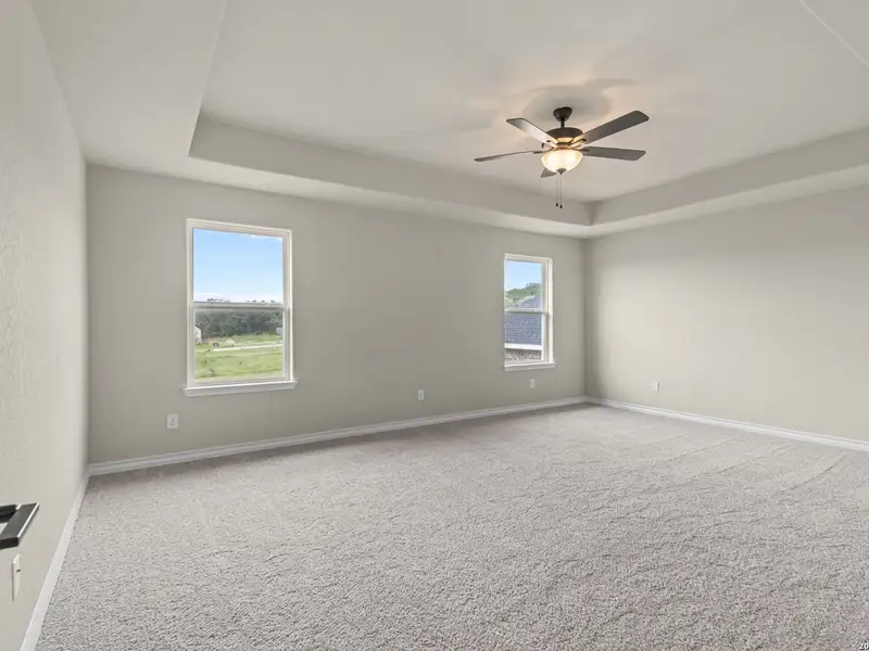 Spacious, unfurnished interior of a new home in The Reserve at Potranco Oaks, Castroville (Image 37).