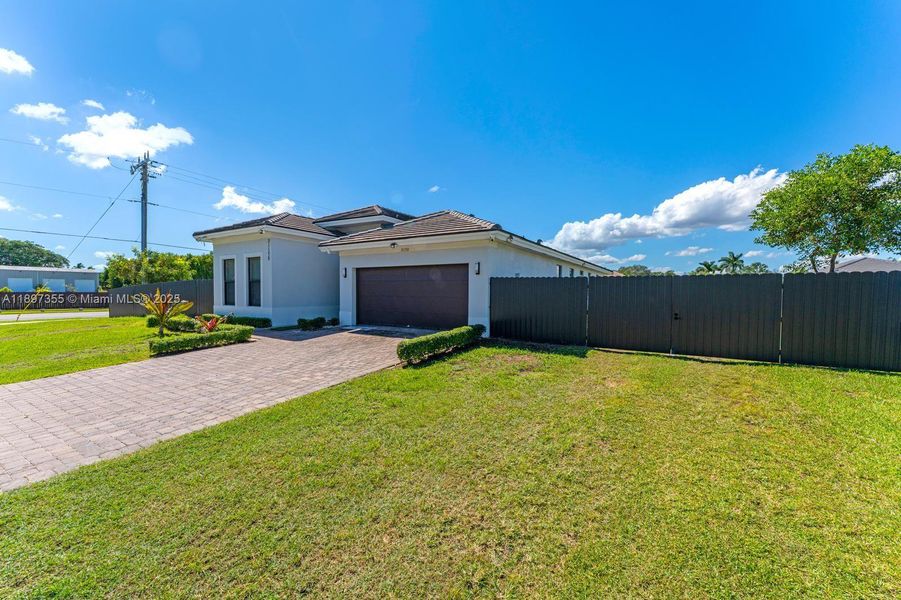 Front exterior of a home in the Century Royal Homes community, located in Homestead, FL (Image 2).