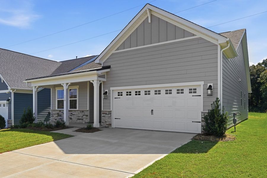 Front exterior of a new home in Esplanade at Northgate, Indian Trail, NC, highlighting curb appeal (Image 2). Front exterior of a new home in Esplanade at Northgate, Indian Trail, NC, highlighting curb appeal (Image 2).