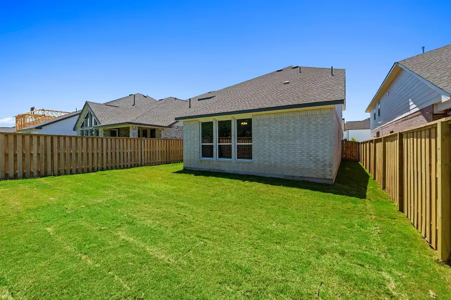 Exterior details and patio area of a home in Parmer Ranch, Georgetown (Image 4).