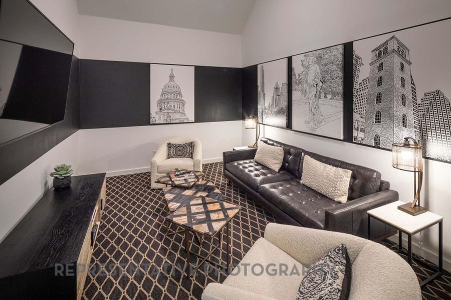 Living area featuring carpet flooring, lofted ceiling, and baseboards Living area featuring carpet flooring, lofted ceiling, and baseboards