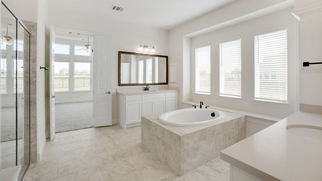 Representative furnished interior of a home built from the Dartmouth by DRB Homes in Creekhaven, Iowa Colony (Image 12).