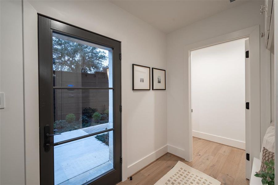 Doorway to outside featuring light wood-type flooring