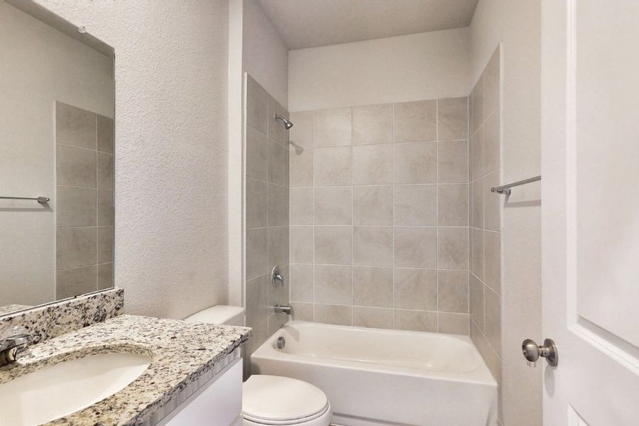 A bathroom with a marble countertop. A bathroom with a marble countertop.